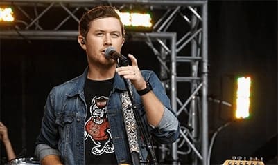 A singer at a church live concert holds the microphone.