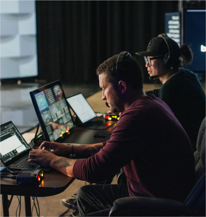 CTS audio engineer working a sound board during a live performance