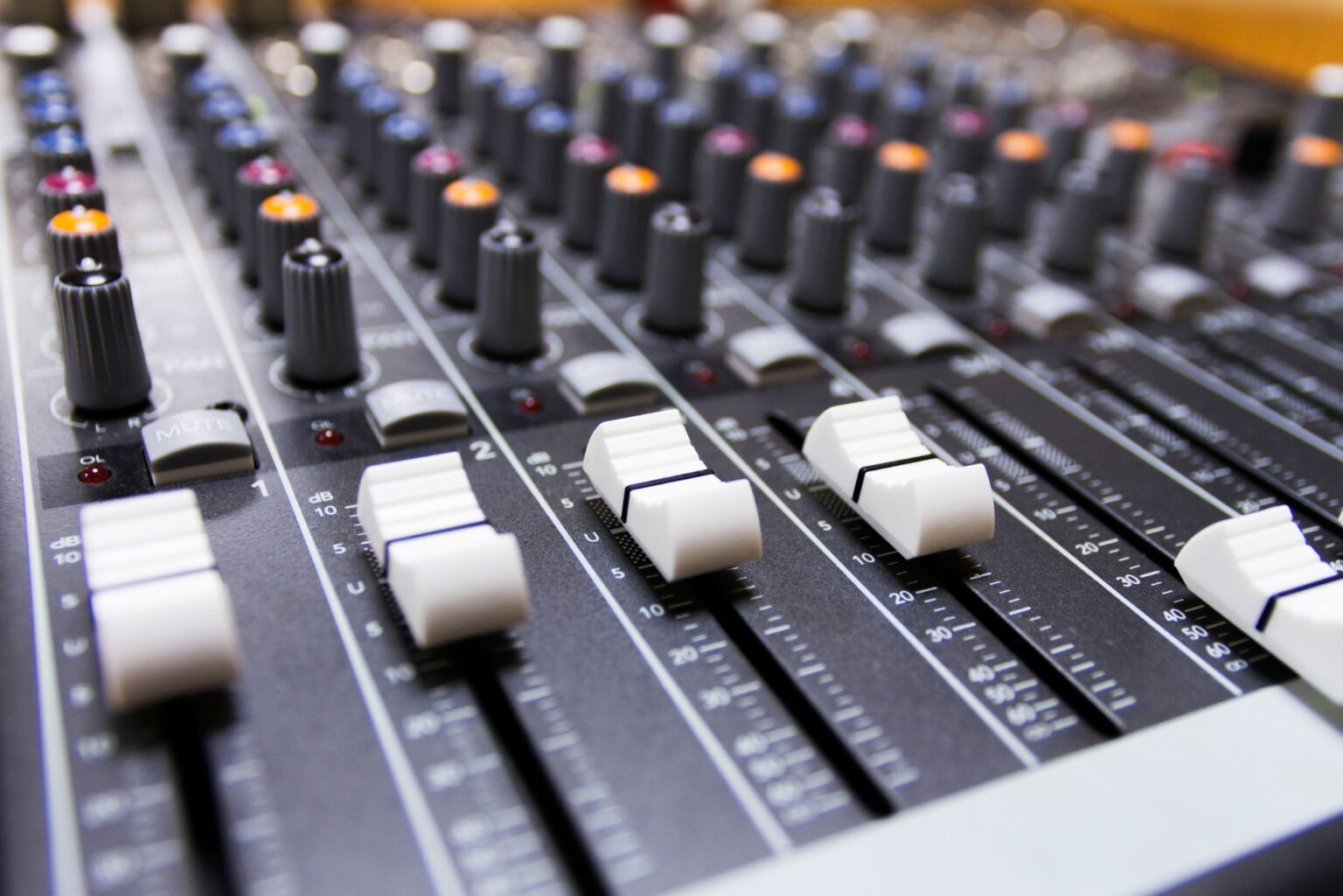 A range of buttons on a board to adjust the church sound system.