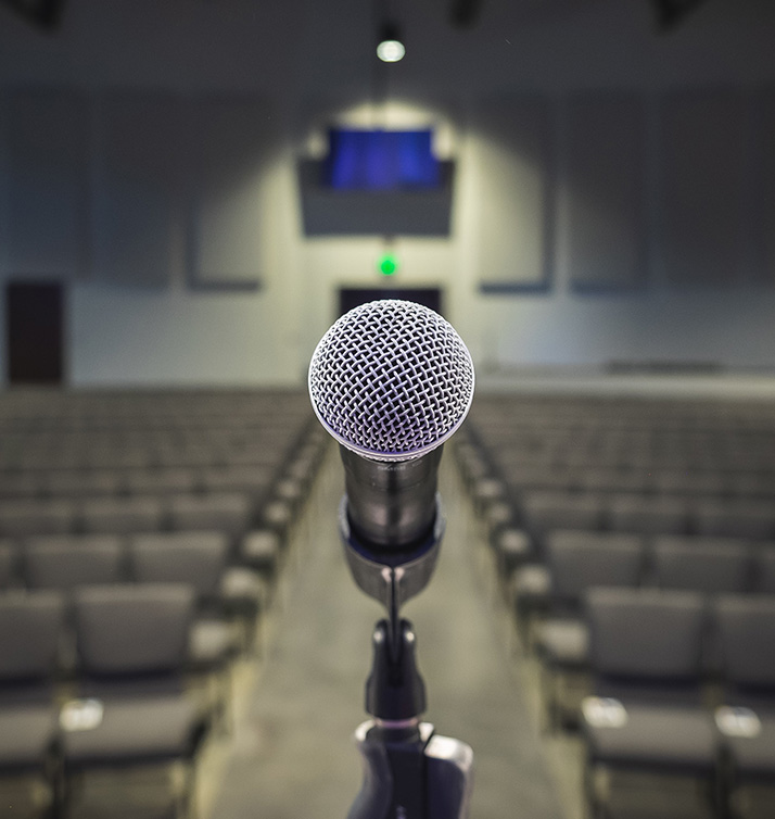 Microphone closeup on a stage in an auditorium